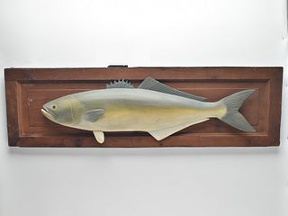 Carved bluefish mounted on door panel.