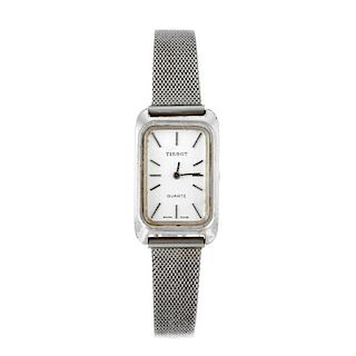 TISSOT - a lady's bracelet watch. Numbered 34004. Unsigned quartz calibre 2032. Silvered dial with b