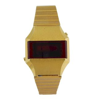 A gentleman's bracelet watch. Gold plated case with stainless steel case back. Quartz movement. LED