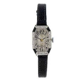 A lady's cocktail wrist watch. White metal case with diamond set bezel, engraved 'Platinum'. Replace