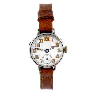 A trench style wrist watch. Silver case with engraved case back, import hallmark London 1916. Unsign