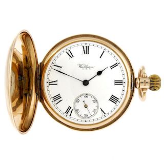 A full hunter pocket watch by Waltham. 9ct gold case with a presentation inscription to dust cover,
