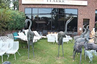 2 Large Patinated Metal Heron Sculptures.