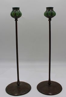 A Pair Of Bronze Tiffany Style Candlesticks