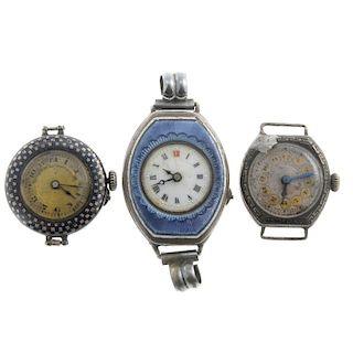 A group of five assorted watches, to include a silver example and a continental white metal example.