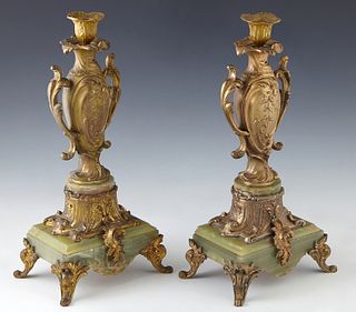 Pair of Gilt Bronze and Onyx Garniture Candlesticks, c. 1890, the candle cup on a bulbous tapered support to a stepped green onyx rectangular base, on