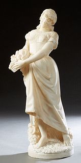 Art Nouveau Carved White Marble Figure, c. 1900, of a woman with a basket of fruit, grape bunches at her feet, on an integral circular marble base, H.