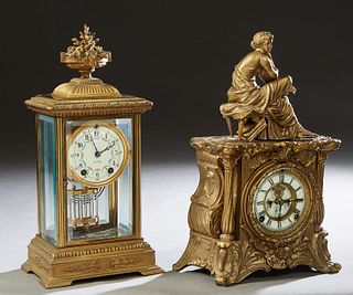 Two American Mantel Clocks, c. 1900, one an open escapement Art Nouveau brass example, now with a seated classical female surmount; together with a Se