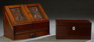 English Carved Oak Stationery Cabinet, c. 1900, the slanted front opening to an interior with letter slots and a pen tray, over a bottom drawer; toget