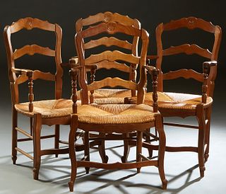 Set of Four French Provincial Louis XV Style Carved Beech Rush Seat Fauteuils, 20th c., the arched ladderback over curved arms and a bowed rush seat, 
