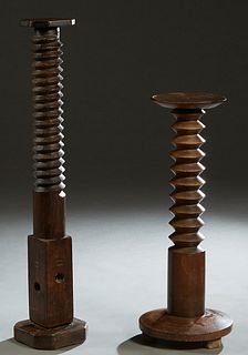 Two French Provincial Grape Press Screws, 19th c., one walnut, one cherry, one with a circular top and base, the second with an octagonal top and base