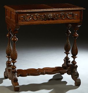 French Henri II Style Carved Walnut Console Table, c. 1880, the stepped edge rectangular top over a long carved frieze drawer, on turned tapered urn f