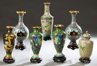 Group of Seven Chinese Cloisonne Baluster Vases, 20th c., consisting of a black example; a covered example; two pairs; and a tapered cylindrical examp