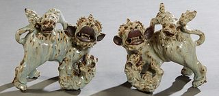 Pair of Chinese Glazed Earthenware Foo Dogs, 19th c., with cubs on their backs, in mottled gray and brown glaze, H.- 7 in., W.- 9 in., D.- 5 1/2 in.