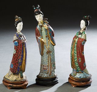 Three Chinese Curved Cloisonne Figures, 20th c., of women with necklaces and faux ivory faces, each mounted with a cabochon turquoise, Tallest- H.- 12