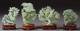 Group of Four Chinese Carved Jade Bird and Floral Figural Groups, 20th c., each on a custom fitted carved mahogany stand, Largest Figure- H. 8 5/8 in.