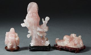 Three Chinese Carved Rose Quartz Figures, 20th c., consisting of a Hotei; a Kwan Yin and a child; and a Hotei with a turtle, each on a carved hardwood