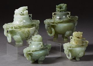 Group of Four Chinese Carved Jade Covered Urns, 20th c., the covers with Foo dog and ring handles, on bases with ring handles, on three paw feet, Pair