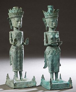 Pair of African Benin Bronze Figural Candlesticks, 20th c., of a king and queen, on stepped square bases, H.- 20 in., W.- 6 1/4 in., D.- 6 1/4 in. Pro