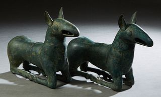 Pair of Patinated Bronze Seated Dog Figures, 20th c., H.- 11 3/8 in., W.- 16 1/2 in., D.- 4 1/2 in. Provenance: Palmira, the Estate of Sarkis Kaltakdj