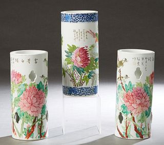 Group of Three Chinese Porcelain Wig Stands, 20th c., with painted floral and bird decoration, H.- 11 1/4 in., Dia.- 5 in. Provenance: Palmira, the Es