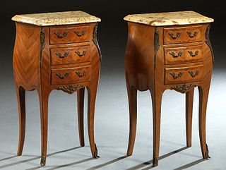 Pair of Louis XV Style Carved Mahogany Marble Top Bombe Nightstands, 20th c., the shaped beveled edge ocher marble over a bank of three drawers, flank