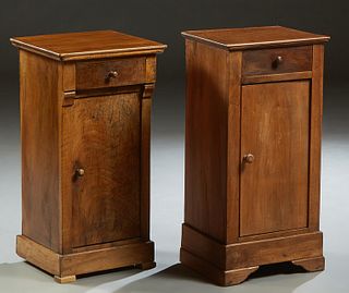 Near Pair of French Louis Philippe Style Carved Walnut Nightstands, late 19th c., the rectangular top over a frieze drawer, and a long cupboard door, 