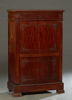 Continental Carved Mahogany Secretary Abattant, 19th c., the gadrooned edge top over a frieze drawer, above a fall front gilt tooled leather writing s