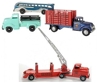 Four Toy Floor Trucks and a Bus