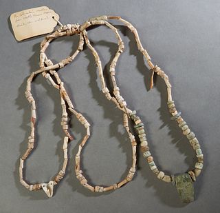 Pre-Columbian Jadeite Stone and Fossil Four Strand Beaded Necklace, from Mittla Ruins, Mexico, with a carved jadeite face pendant, L.- 14 1/2 in. Prov