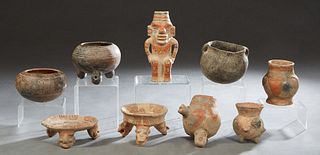 Group of Nine Pieces of Pre-Columbian Style Pottery, 20th c., consisting of seven round bowls, a standing figure, and a pitcher, Figure- H.- 8 1/4 in.