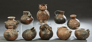 Group of Ten Pre-Columbian Style Pottery Vessels, 20th c., consisting of eight pitchers with relief animal decoration, an owl, and a frog, Owl- H.- 8 