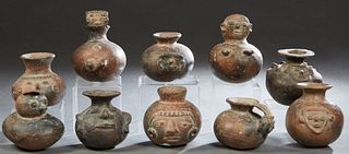 Group of Ten Pre-Columbian Style Pottery Vessels, 20th c., nine with relief figural decoration, one of bird form, Largest- H.- 8 in., W.- 6 1/2 in., D