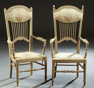 Pair of Louis XVI Style Carved Beech Fauteuils, early 20th c., the canted arched upholstered back over vertical spindles, to a cushioned seat flanked 