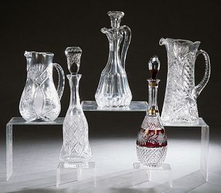 Five Pieces of Cut Glass, 20th c., consisting of two decanters with stoppers, two pitchers, and a ruby cut-to-clear decanter, Tallest Decanter- H.- 16