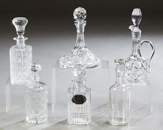 Group of Six Cut Glass Decanters and Stoppers, 20th c., two of square form, 2 of cylindrical form; a flat ships example; and a handled ewer style, one