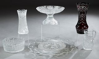 Group of Six Pieces of American Cut Glass, 20th c., consisting of a large circular tray; a waisted cylindrical vase; a large compote; a scalloped top 