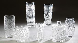 Group of Seven Pieces of Cut Glass, 20th c., consisting of an oval vase; four circular vases; a covered biscuit barrel; and a baluster bowl, Tallest V