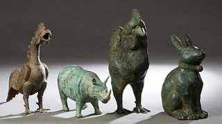 Group of Four Patinated Bronze Animals, 20th c., consisting of two roosters, a seated rabbit and a rhinoceros, Largest Rooster- H.- 15 1/2 in., W.- 12
