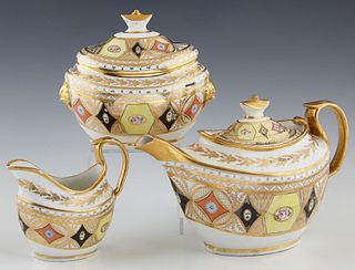 Three Piece Porcelain Tea Set, 19th c., unsigned, possibly Derby, consisting of a teapot, creamer and covered sugar, with gilt tracery and orange and 