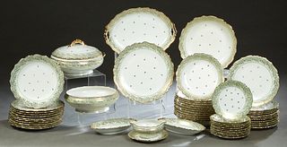 Fifty-Two Piece Set of Limoges Porcelain Dinnerware, 20th c., by Andre, with gilt rims and gilt tracery borders, consisting of 12 soup bowls, 10 salad
