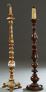 Two French Spanish Style Carved Beech Floor Lamps, 20th c., one with gilt and polychromed decoration on knopped supports, to a base on gilt tripodal p