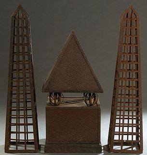 Three Pieces of Iron Garden Decoration, 20th/21st c., consisting of a pair of lattice tapered obelisks, together with a peaked iron chimney top, Obeli