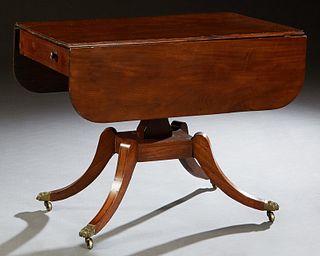 English Carved Mahogany Drop Leaf Pembroke Table, late 19th c., the rounded corner drop leaves over one end drawer and a faux drawer on the other end,
