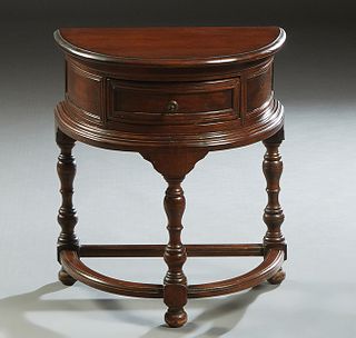 French Louis XIV Style Carved Walnut Nightstand, 20th c., of demilune form with a center frieze drawer, on three turned legs joined by a flat semi-cir