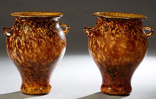 Unusual Large Pair of Blown Glass Baluster Footed Urns, 20th c., with applied handles, probably Murano glass, H.- 14 in., W.- 12 in., D.- 10 in. Prove