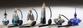 Group of Six Art Glass Perfume Bottles, 20th c., consisting of four feathered atomizers, and two swirled glass bottles and stoppers, Tallest- 7 3/4 in