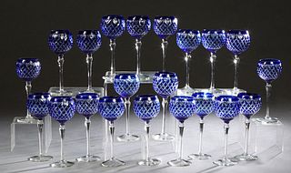 Set of Twenty-one Cobalt Cut-to-Clear Cut Glass Wine Glasses, 20th c., on a tapered stem to a circular base, H.- 9 in., Dia.- 3 1/4 in. (21 Pcs.) Prov
