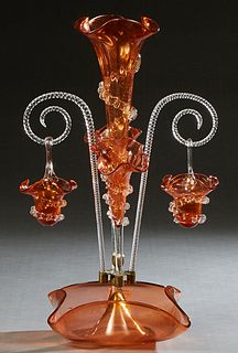 Victorian Blown Pink Glass Epergne, 19th c., with a central glass floriform trumpet vase, flanked by two angled floriform vases and two swirled scroll