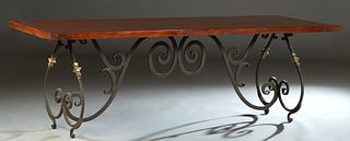 Spanish Style Carved Mahogany and Wrought Iron Dining Table, 20th/21st c., the thick top on scrolled wrought iron and brass legs, joined by a scrolled